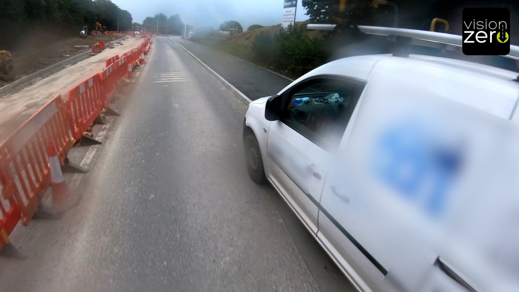 van overtake motorbike pavement